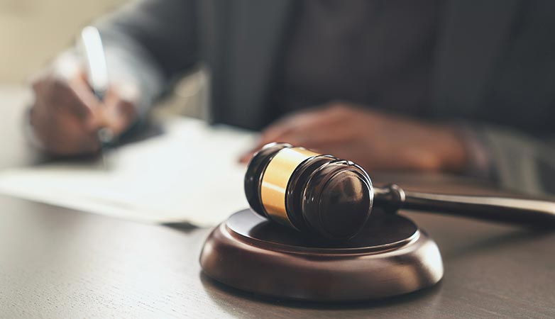 Gavel on its stand, next to the judge.