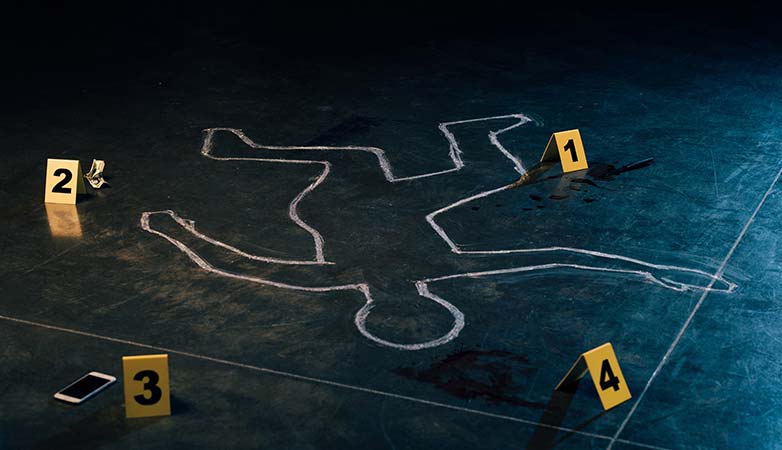 Body outline with blood stains and a phone.